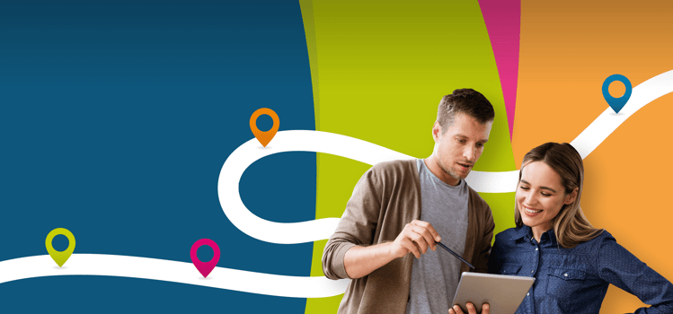 Two colleagues exploring a development roadmap for Insights Discovery on a tablet device